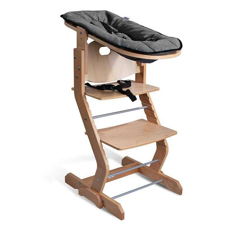 TiSsi Baby insert for TiSsi high chair in solid natural beech wood, including harness and anthracite fabric.